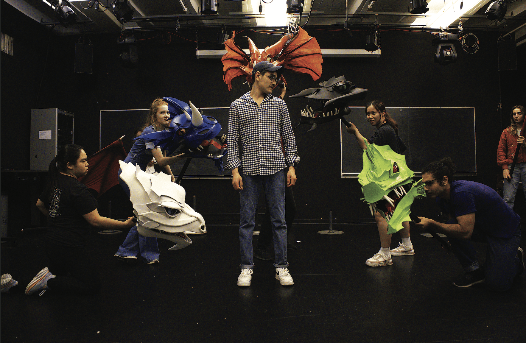 Assistant stage manager Mario Sandoval works with Tiamat Monster photo by Austin Wang.tif